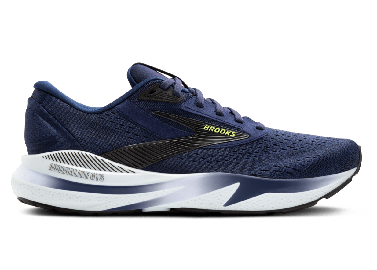 Navy running shoe with white sole on a white background