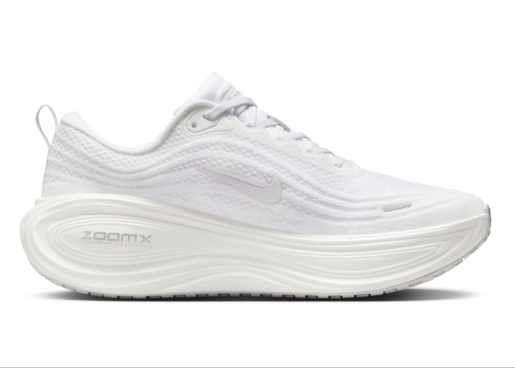 White running shoe with 'ZoomX' branding on a white background