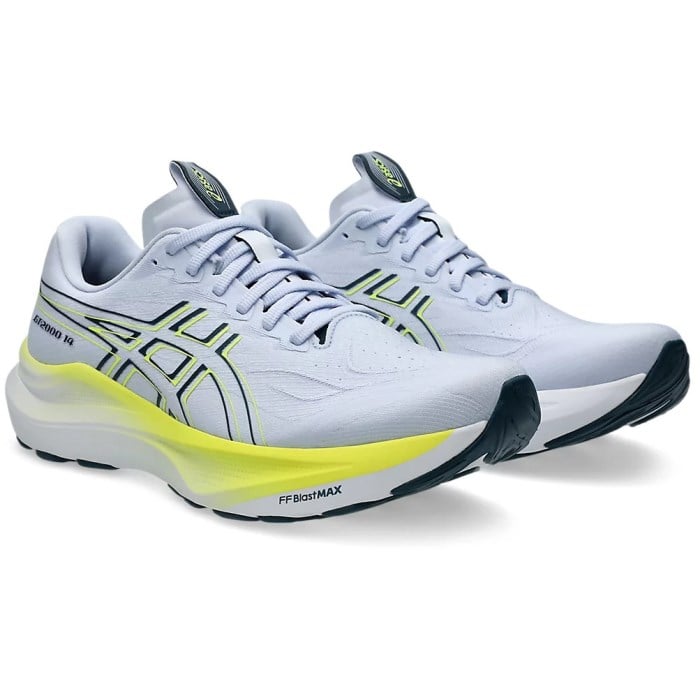 White running shoes with yellow accents on a white background