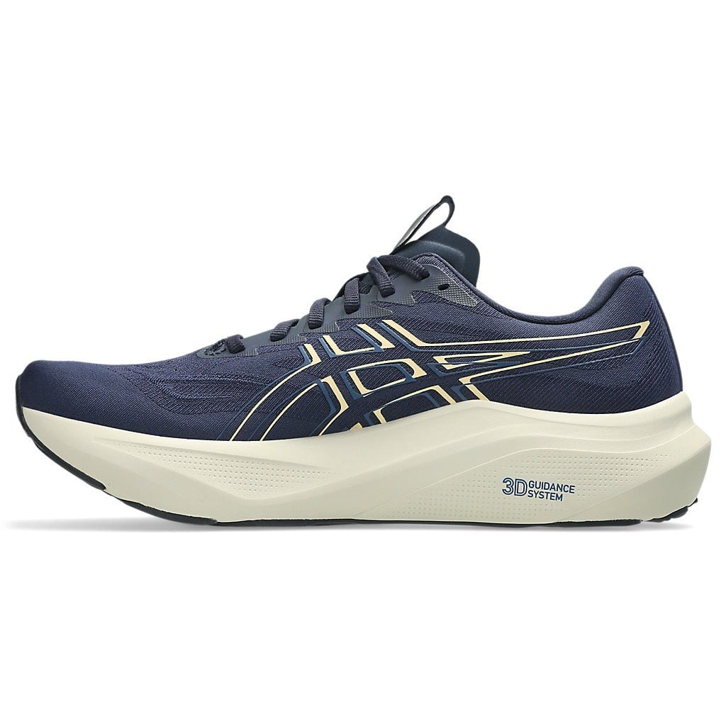 Navy running shoe with white sole on a white background