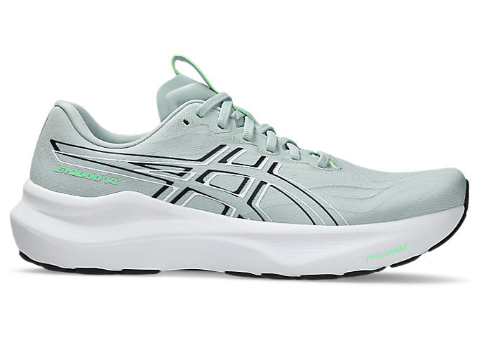 Light gray running shoe with green accents on a white background