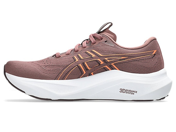 Pink running shoe with orange accents on a white background