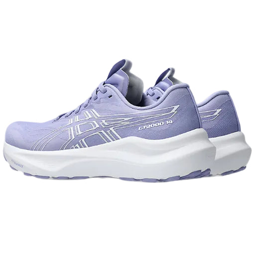 Purple running shoes with white sole on a white background