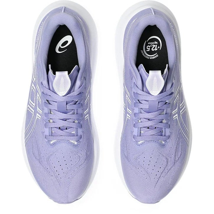 Pair of lavender running shoes with white soles on a white background