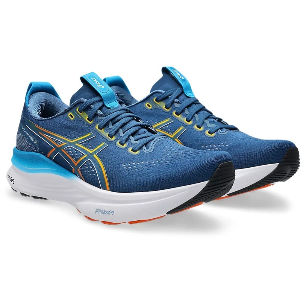 Blue running shoes with white soles on a white background