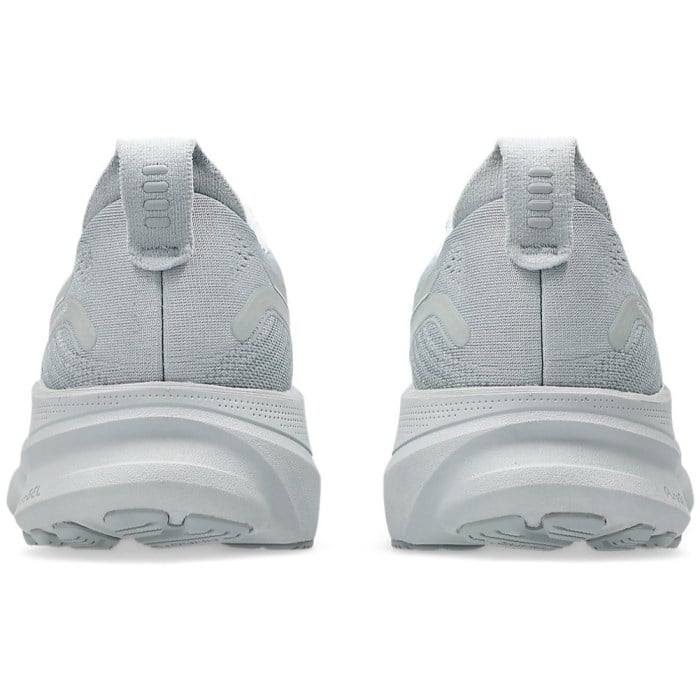 Gray athletic shoes with white soles on a white background