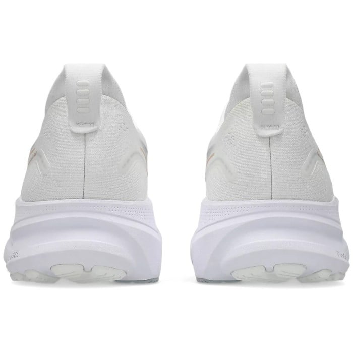 White athletic shoes with sole design on a white background