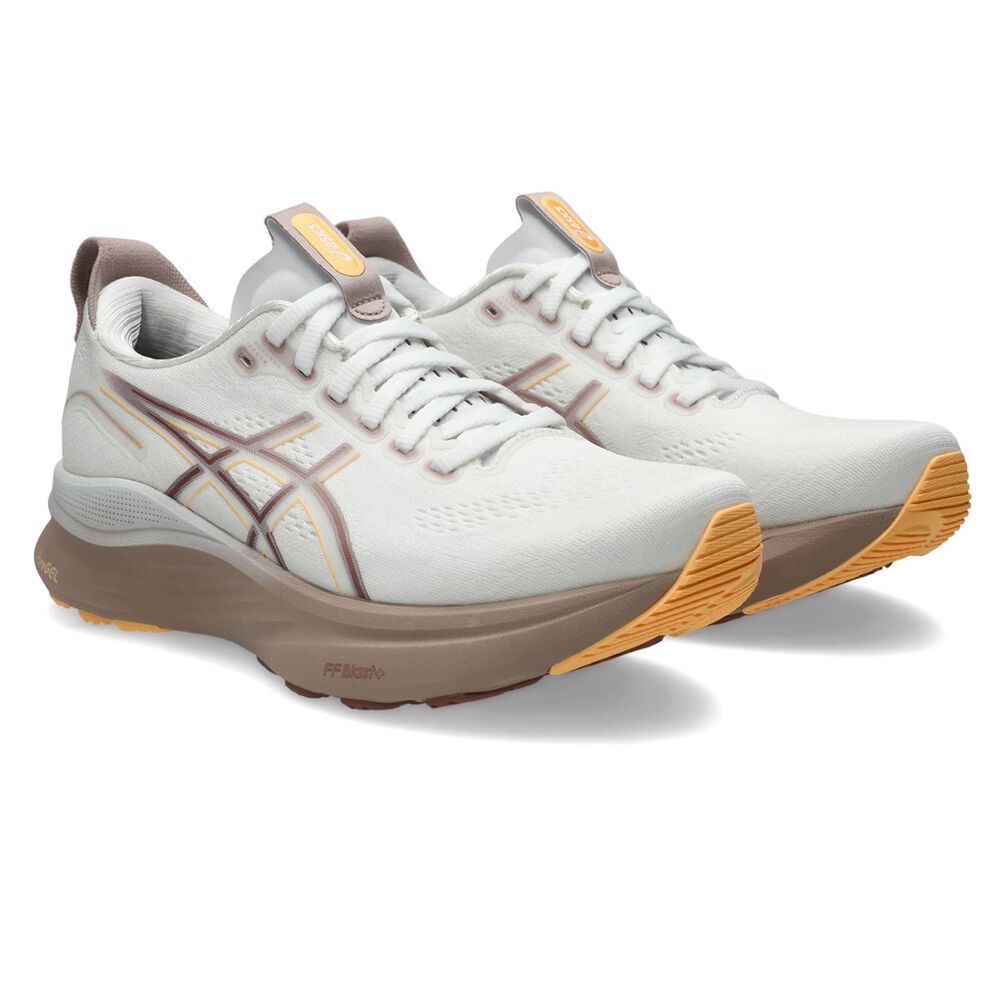 White running shoes with brown and yellow accents on a white background