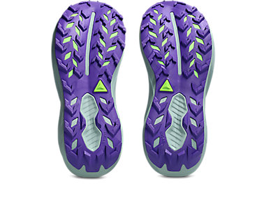 A pair of athletic shoes shown from the sole view, featuring a textured purple outsole with lime green and light gray details, set against a plain white background.