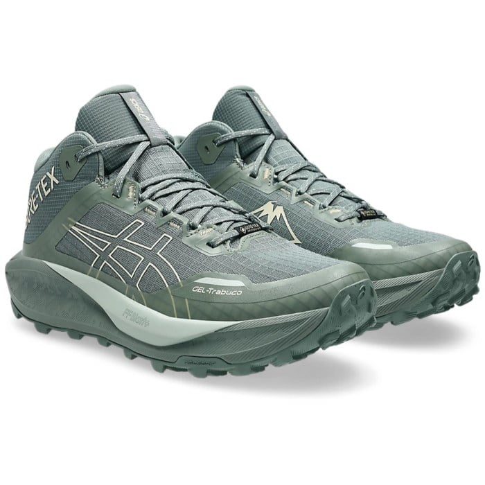 Pair of gray running shoes with Asics logo on a white background