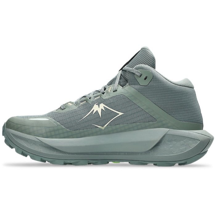 Green hiking shoe with a mountain logo on a white background
