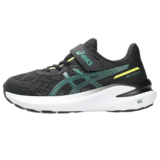 Black running shoe with green accents on a white background