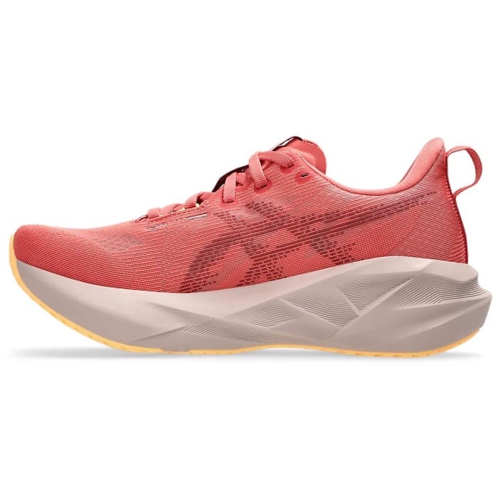 Red running shoe with a white sole on a white background