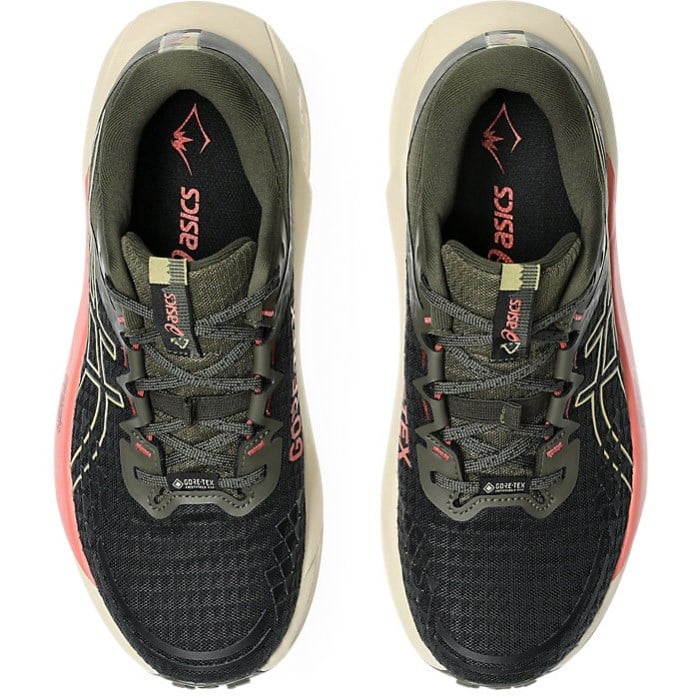 Pair of black and gray running shoes with pink accents on a white background