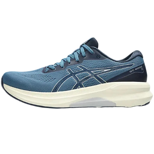 Blue running shoe with white sole on a white background