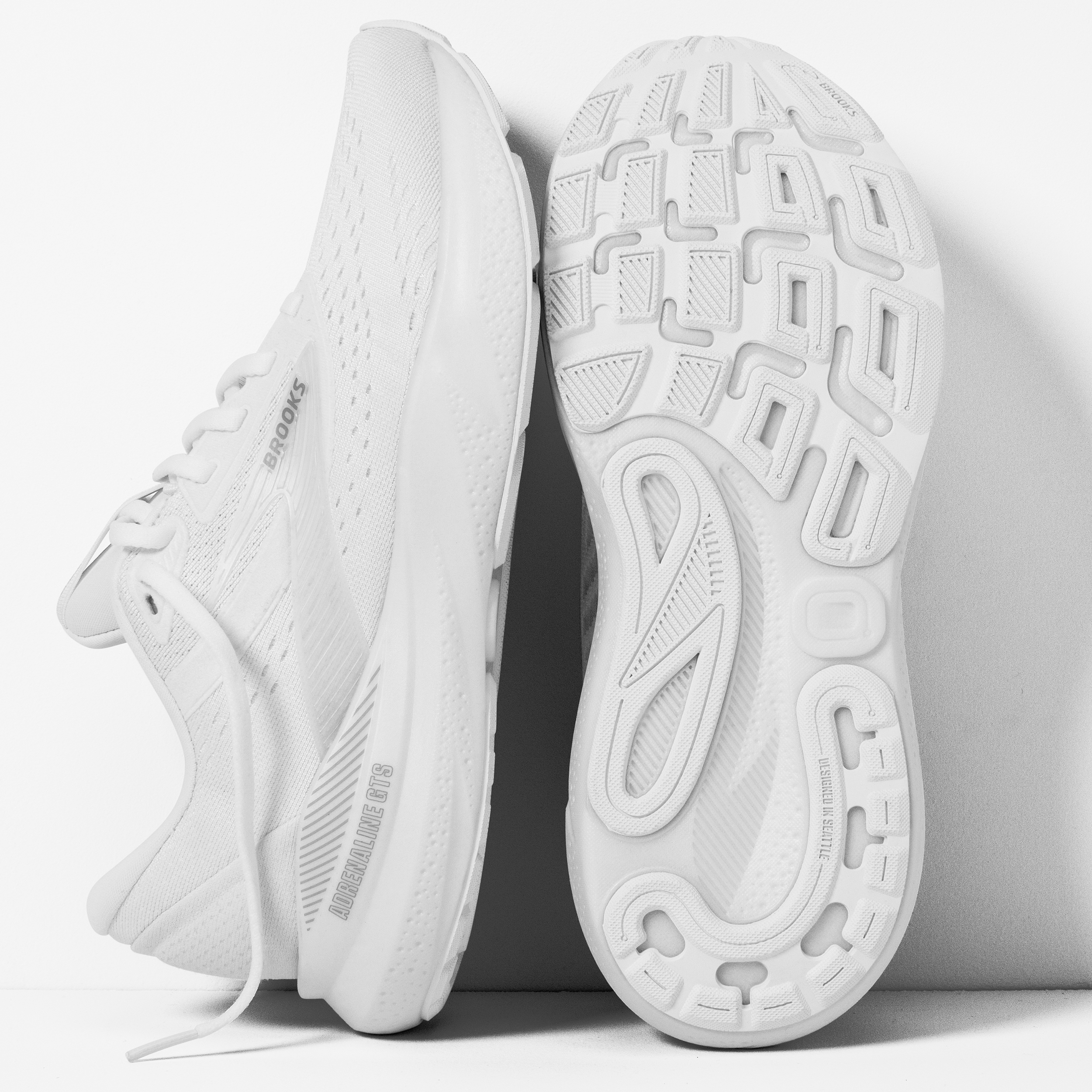 A pair of white Brooks Adrenaline GTS 24 running shoes for women.