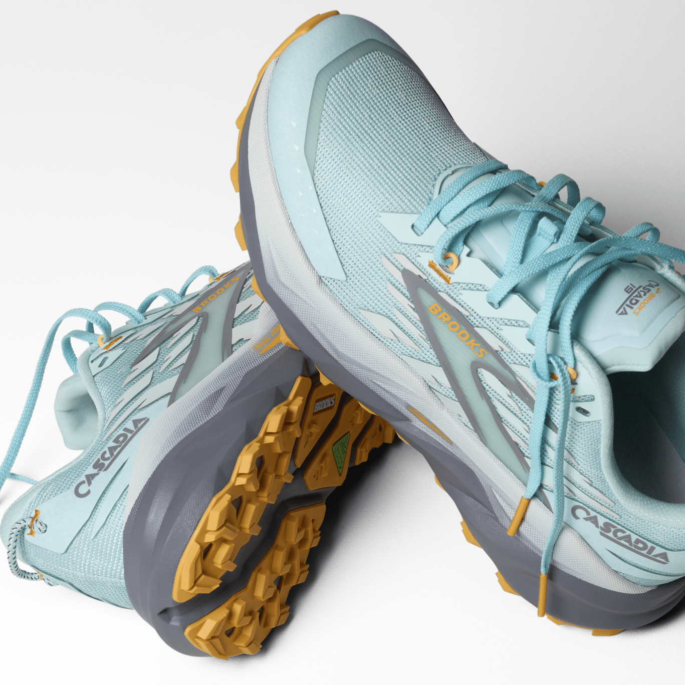 Light blue hiking shoes with yellow accents on a white background