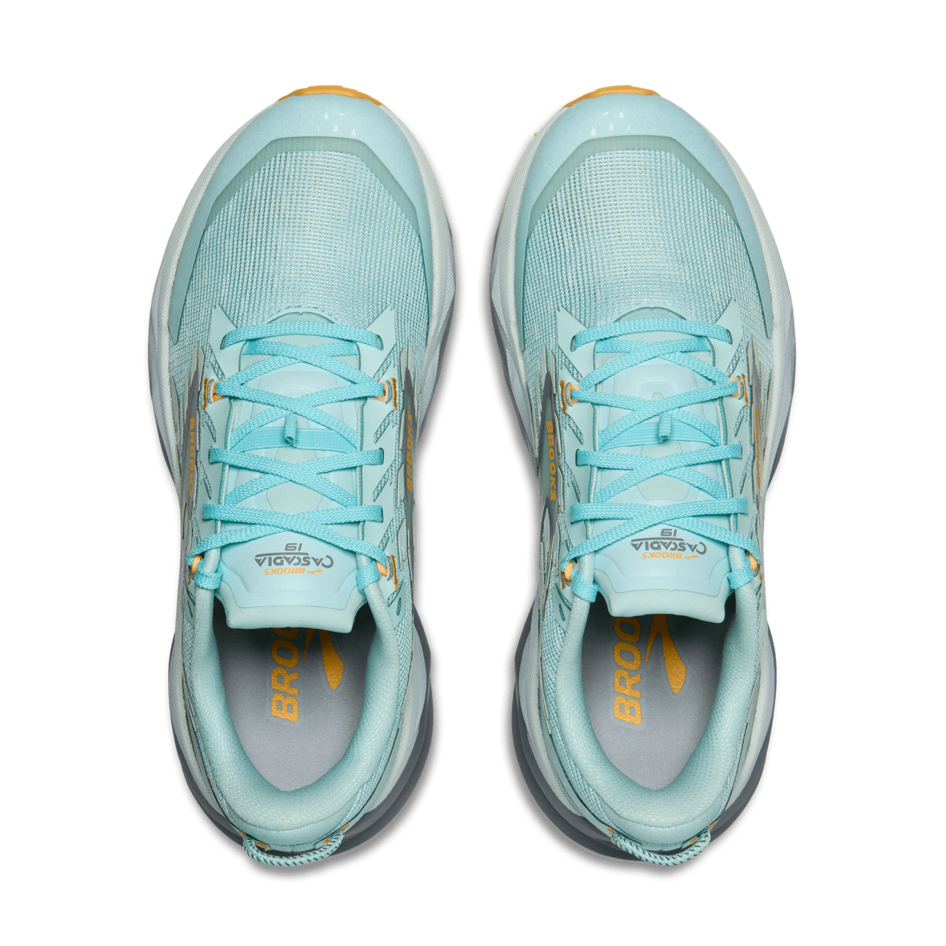 Pair of light blue running shoes with yellow accents on a transparent background