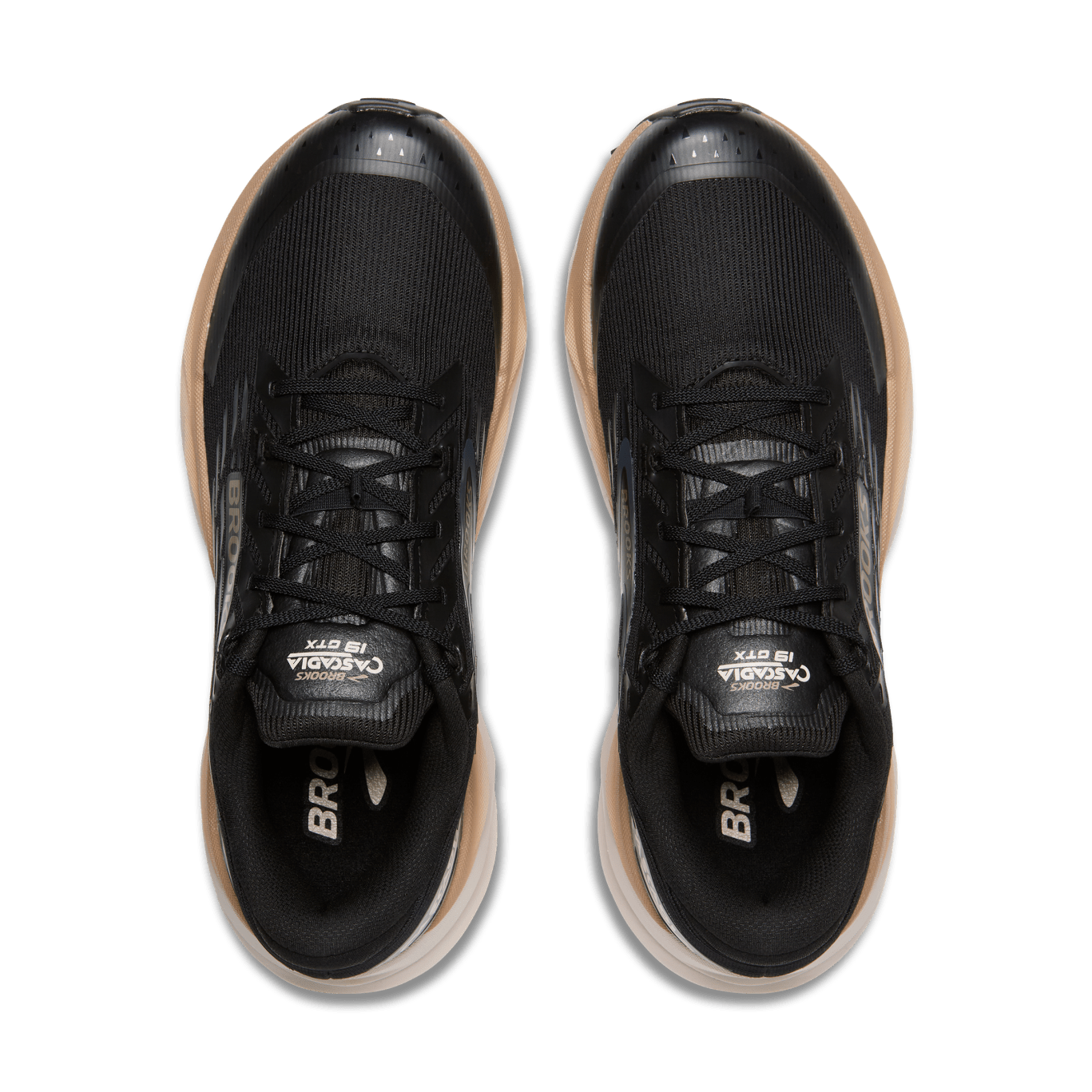 Black running shoes with tan accents on a transparent background