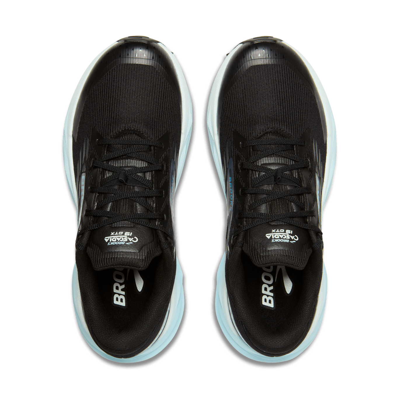 Black running shoes with white soles on a transparent background