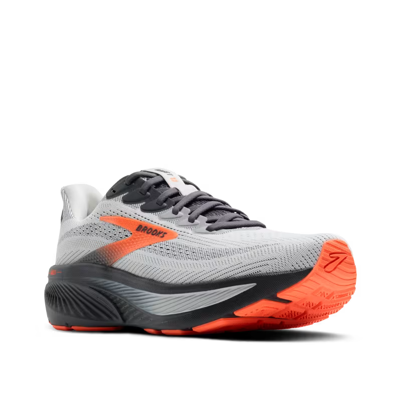 Gray and orange running shoe with 'Brooks' branding on a white background