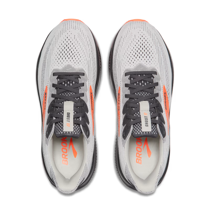 Gray running shoes with orange accents and 'Brooks' branding on a white background