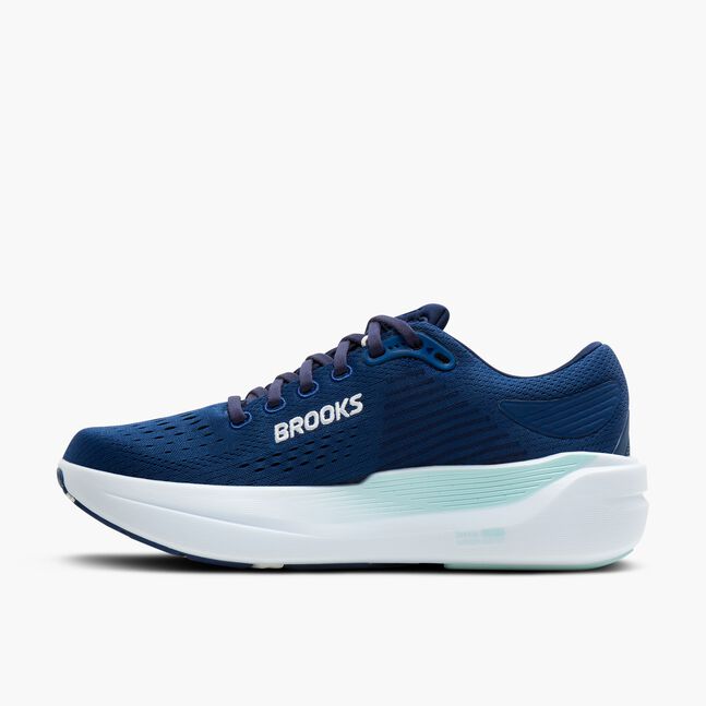 Blue running shoe with white sole on a white background
