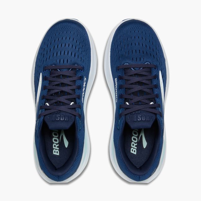 Pair of blue running shoes with white soles on a white background