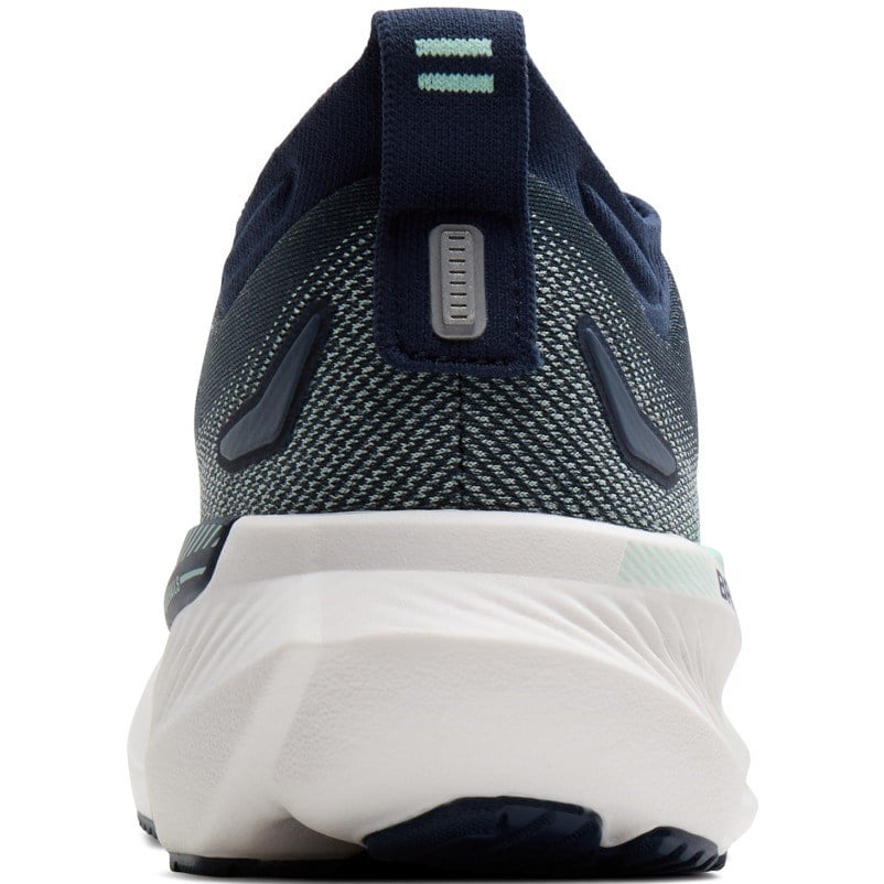 Navy running shoe with white sole on a white background