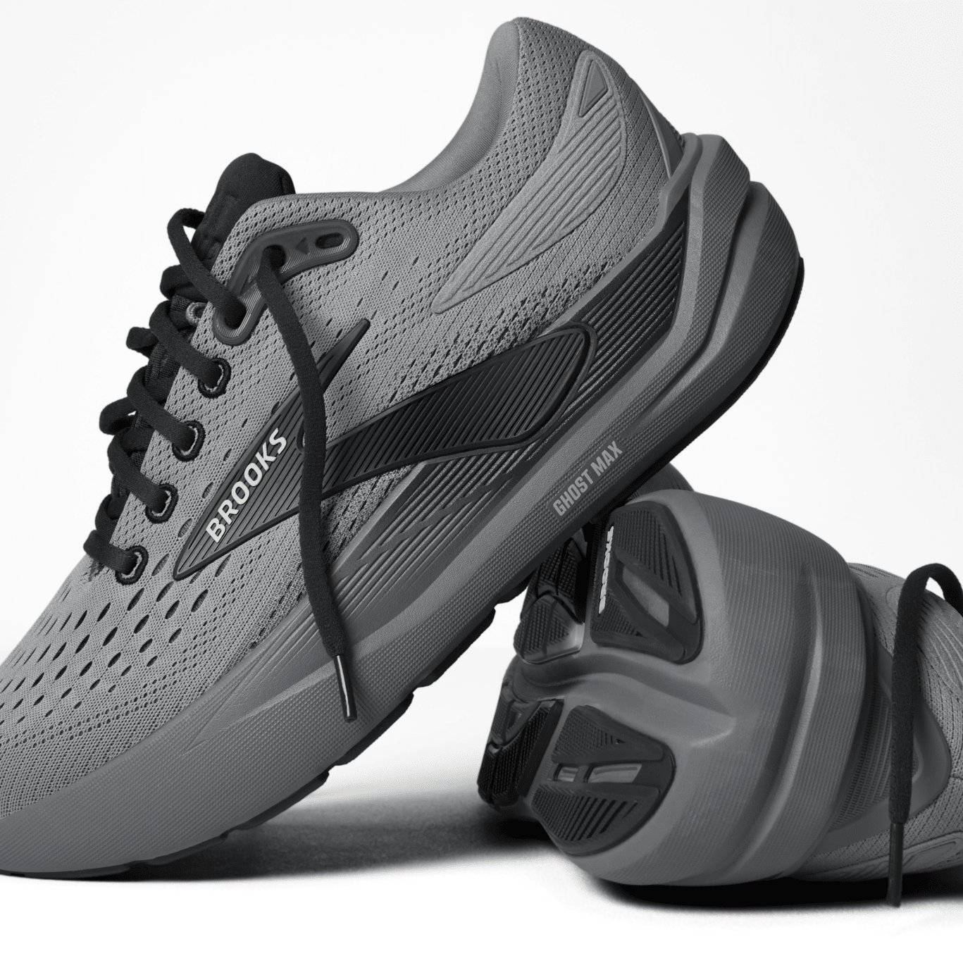 Gray running shoes with black laces on a white background