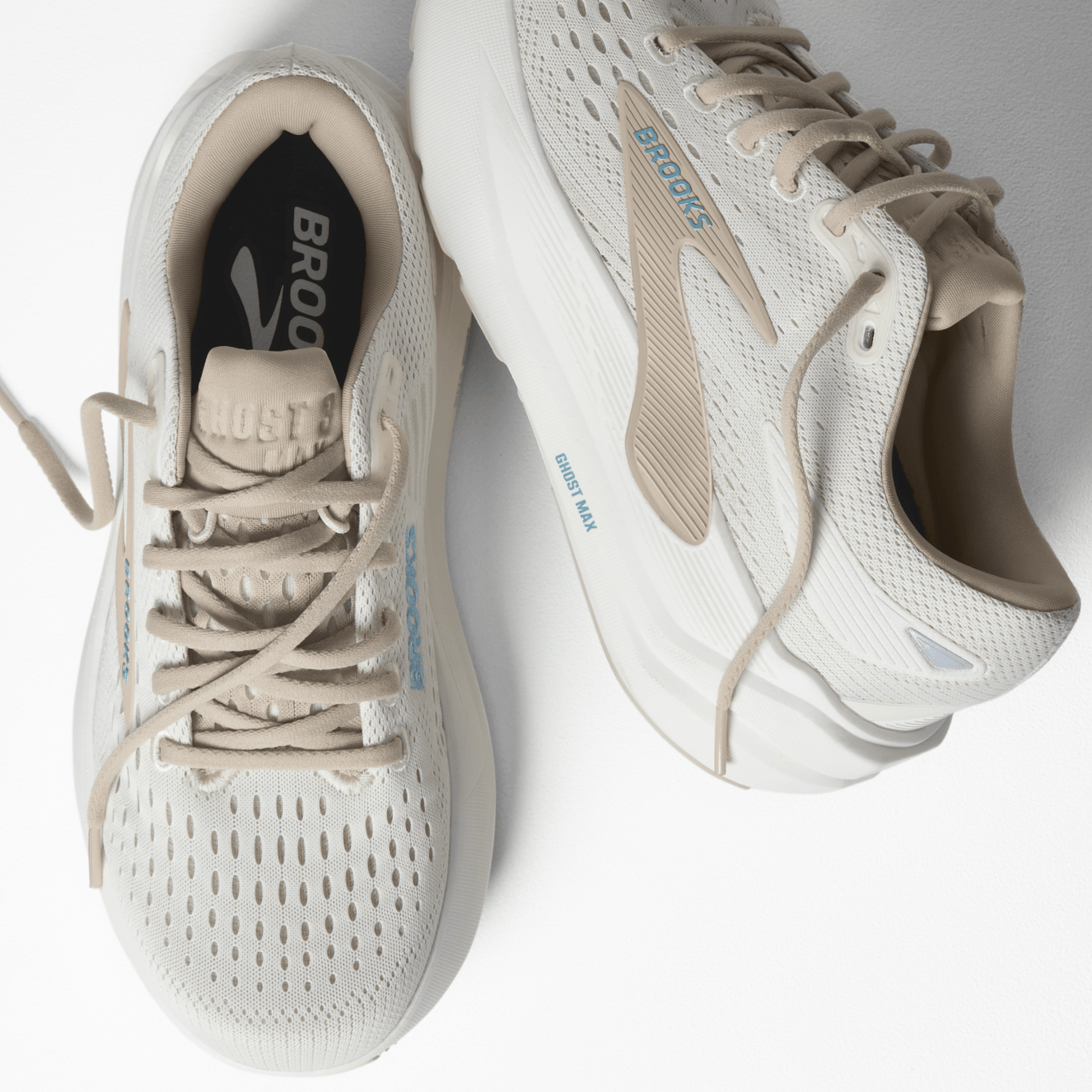 White running shoes with beige accents on a white background