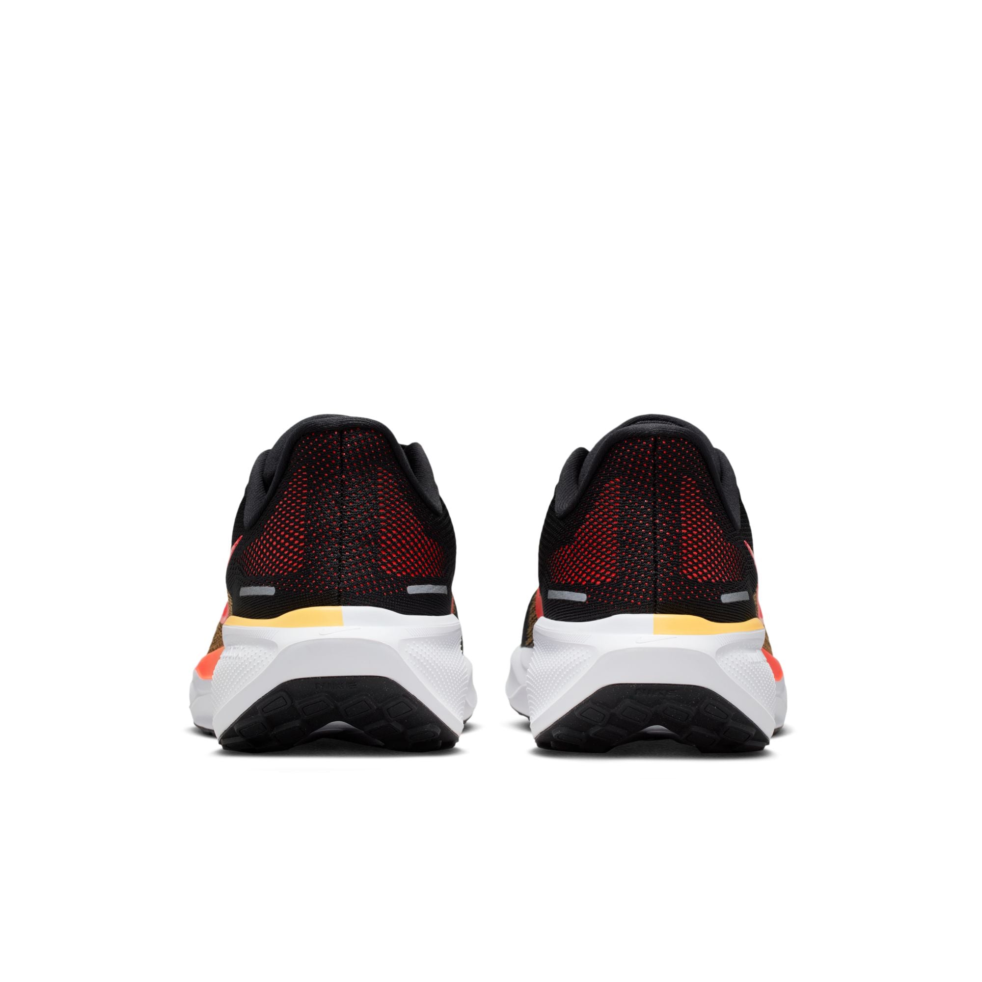 Black and red running shoes with white sole on a white background