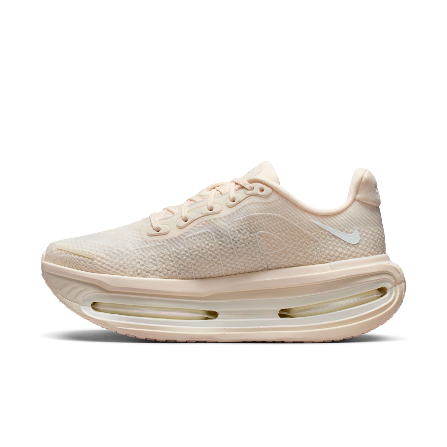 Beige running shoe with a white sole on a white background