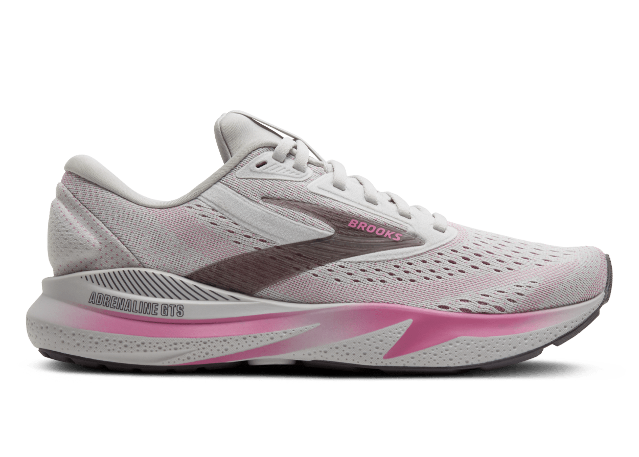White and pink running shoe with 'Brooks' branding on a white background