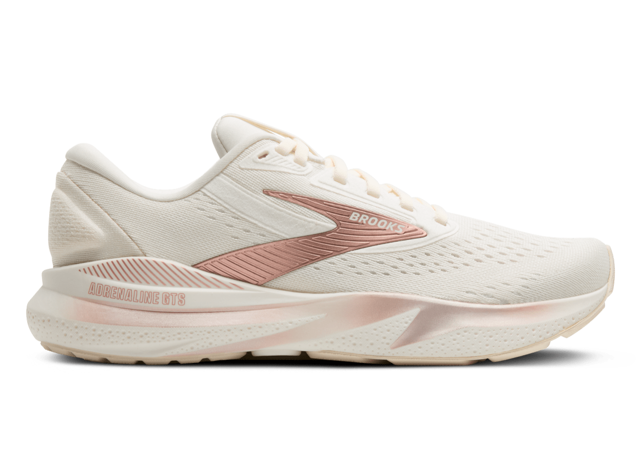 White running shoe with pink accents on a white background