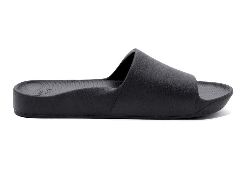 Black slide sandal on a white background