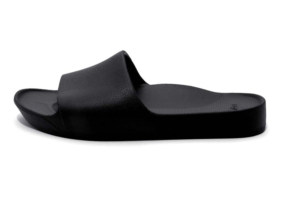 Black slide sandal on a white background
