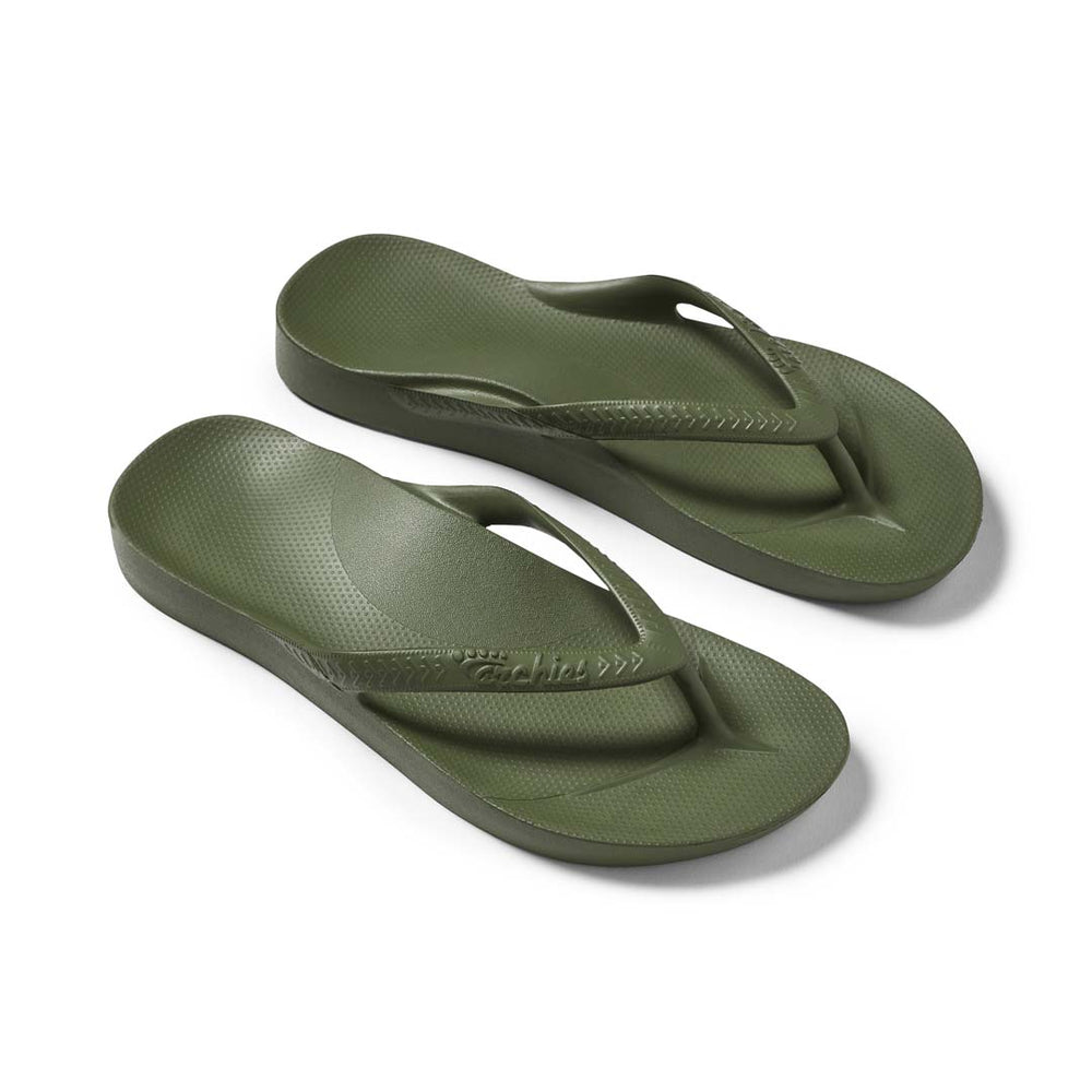 Pair of green flip-flops on a white background