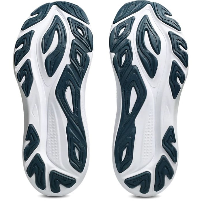 Close-up of white and blue athletic shoe soles on a white background