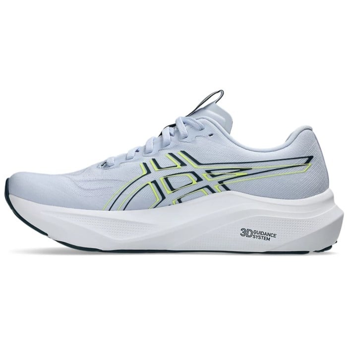 White running shoe with green accents on a white background