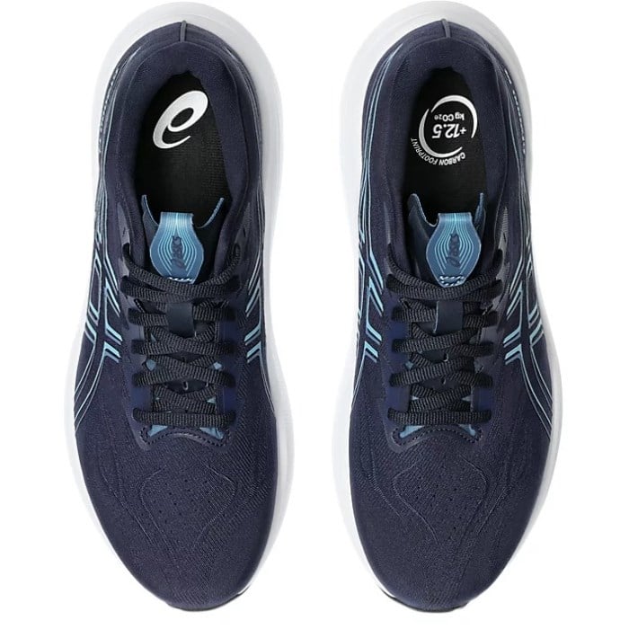 Pair of navy running shoes with white sole on a white background