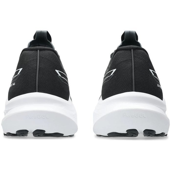 Black athletic shoes with white soles on a white background