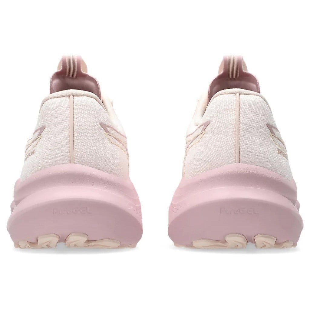 White sneakers with pink soles on a white background