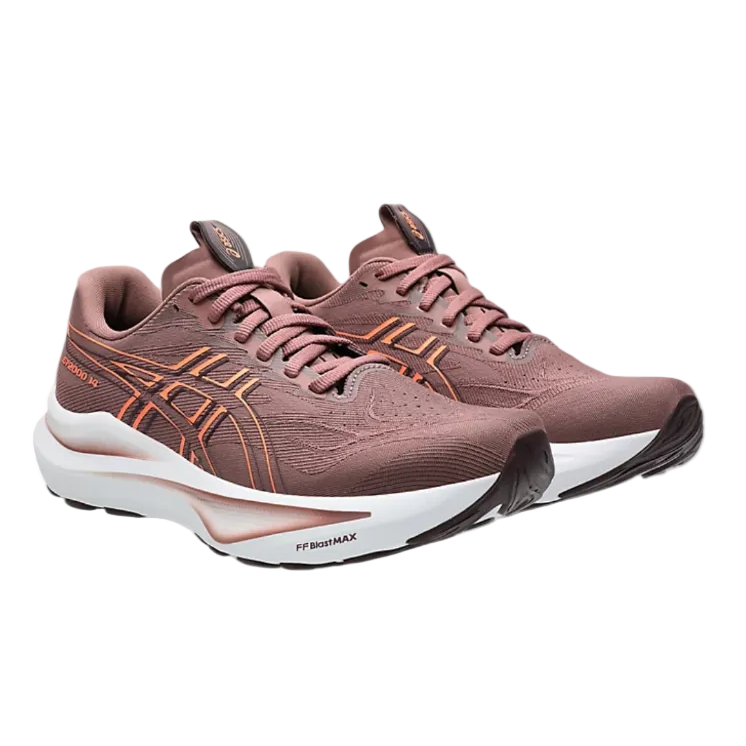 Pair of pink running shoes with white soles on a white background