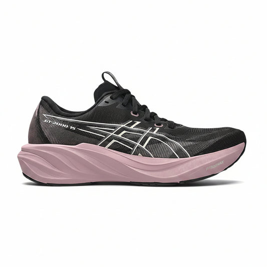A black ASICS sneaker with a thick, wavy light pink sole and white logo details, shown from a side profile on a white background.