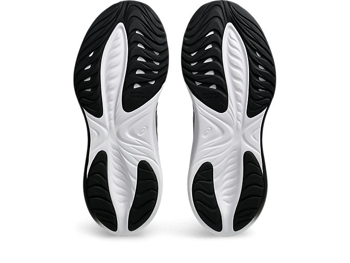 Black and white shoe soles on a white background