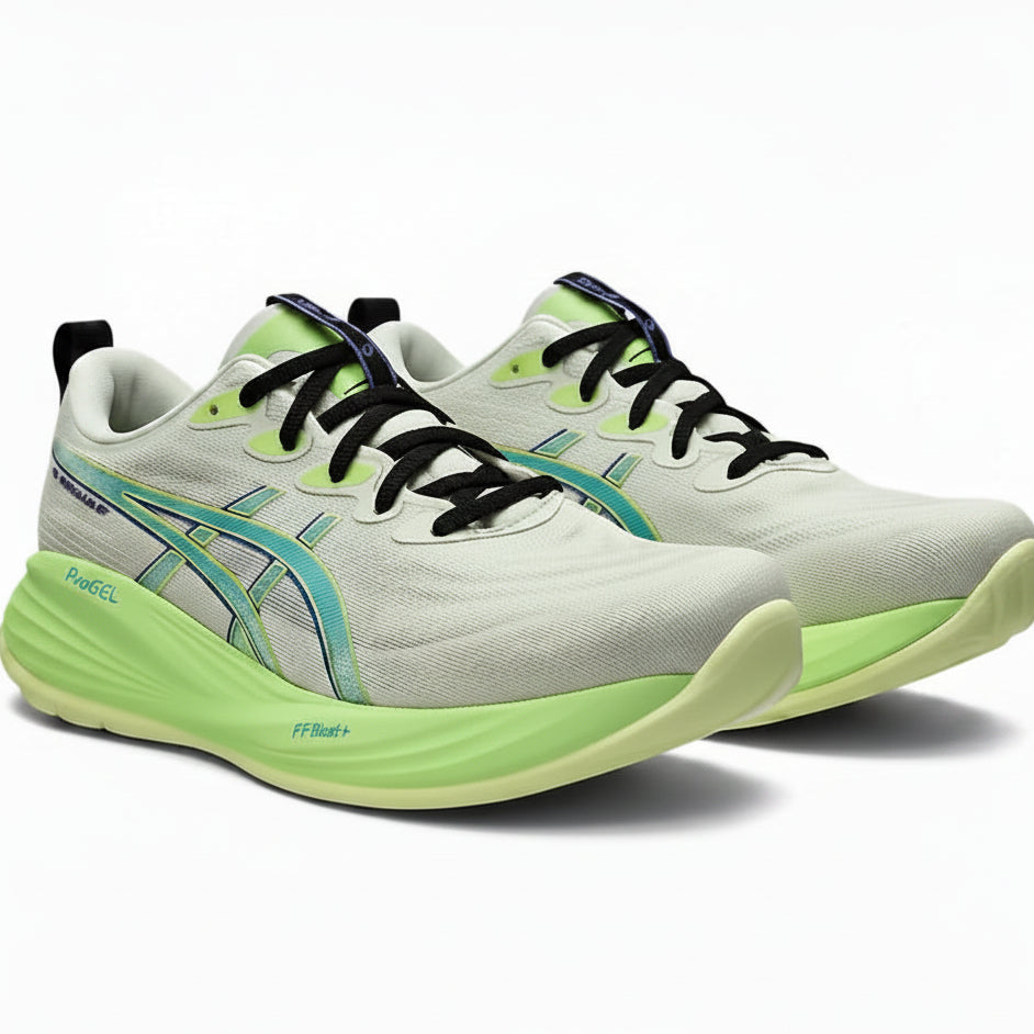 White and green running shoes with black laces on a white background