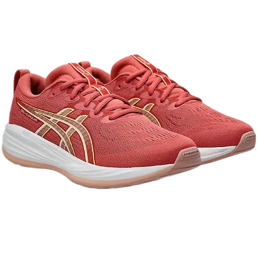 Red running shoes with white soles on a white background