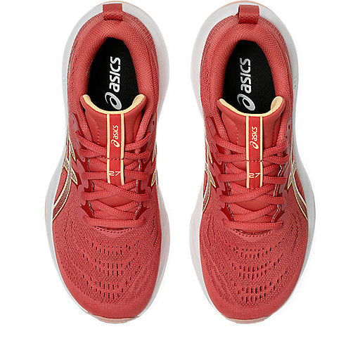 Red running shoes with white soles on a white background