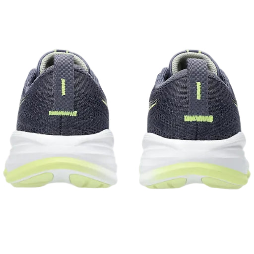 Navy running shoes with white soles and green accents on a white background
